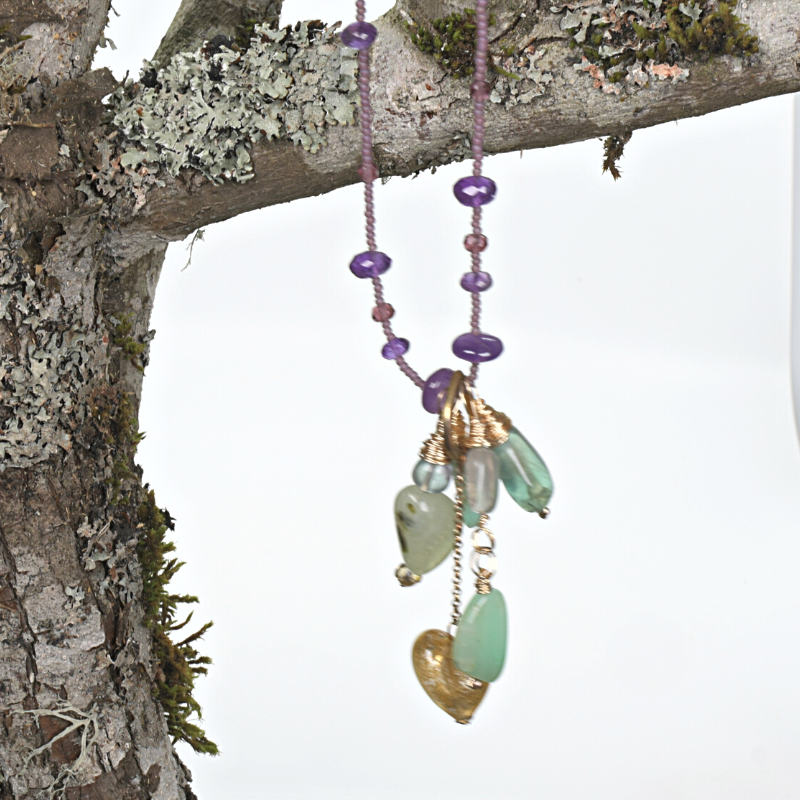Long beaded necklace with multiple pendant charms in amethyst, fluorite, chrysoprase and prehnite stones. Designed and handcrafted by Ula Frou creator Sadie Hodson on Salt Spring Island.